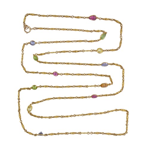 Late 19th century gold and vari-coloured gem set long chain necklace, c.1895, spaced by sapphires, peridots, yellow, pink and orange gems,